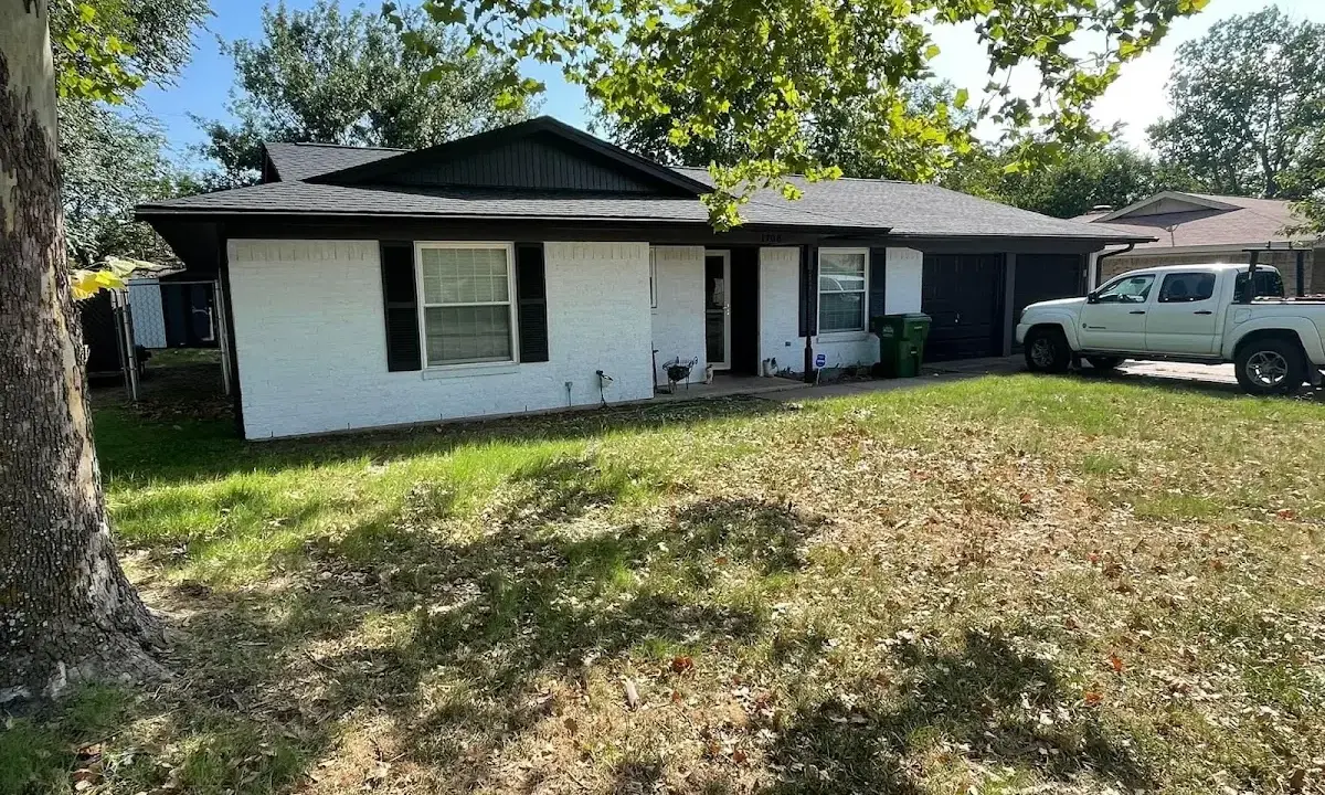 Professional roofing crew working on a residential roof in Pembroke